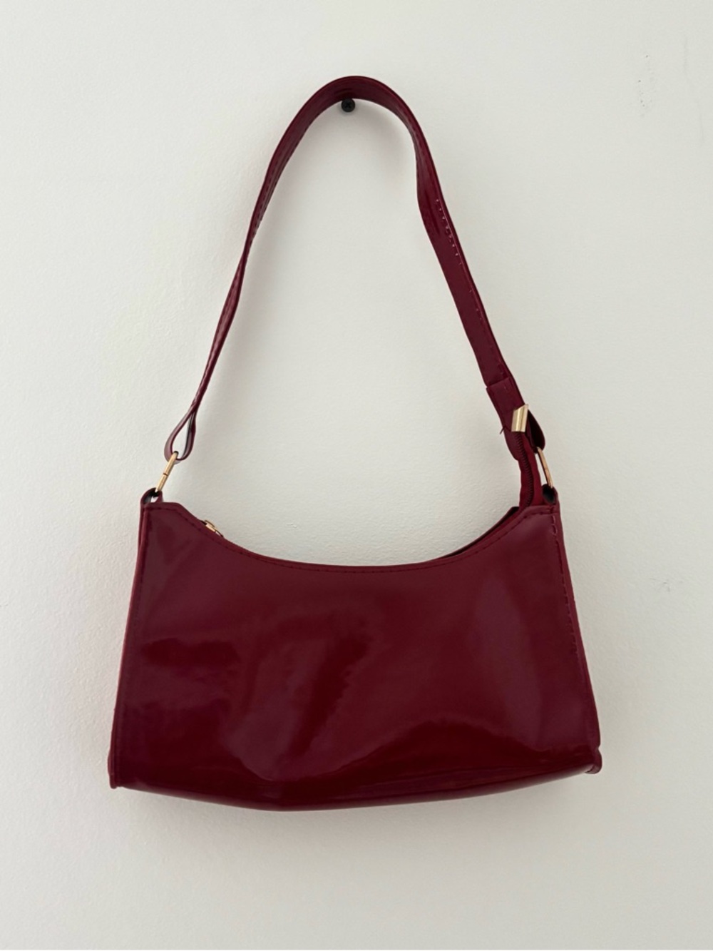 burgundy shoulder bag with gold zipper